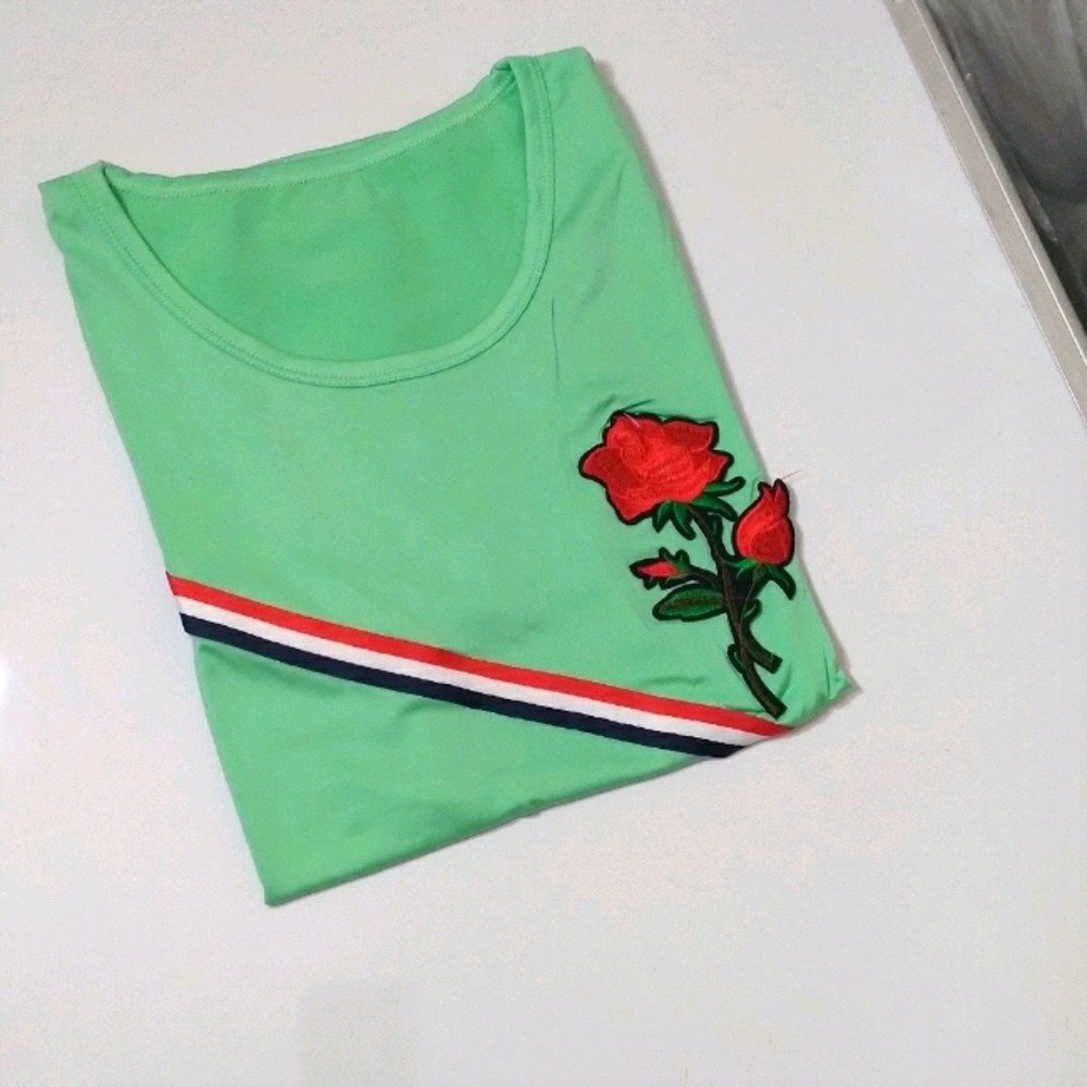 Green with small details short sleeve shirt.